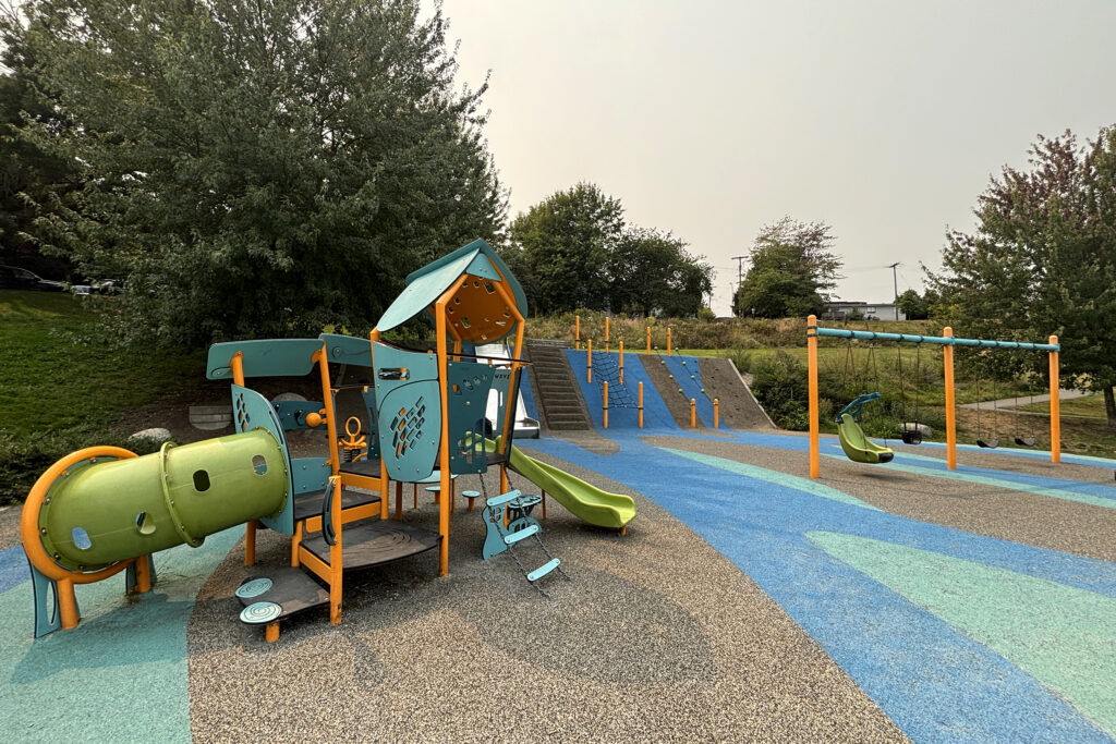 An example of a Vancouver park that features accessible elements like rubber turf and a supportive swing.